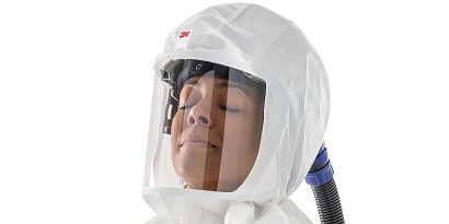 Woman wearing 3M PAPR Headtop

