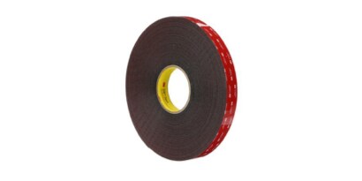 A roll of tape with a yellow center
