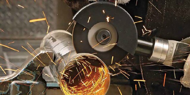Cutting application using a 3M Silver Cut-off Wheel with sparks flying
