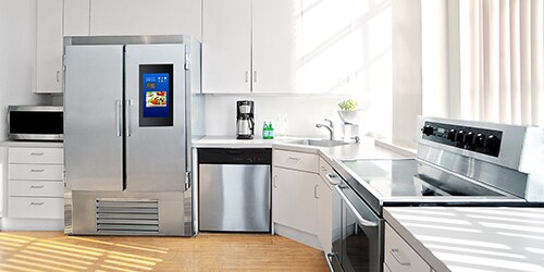 Modern spacious kitchen with latest appliances and sunlight pouring in.
