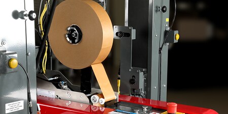 Paper sealing tape in an automated sealer.
