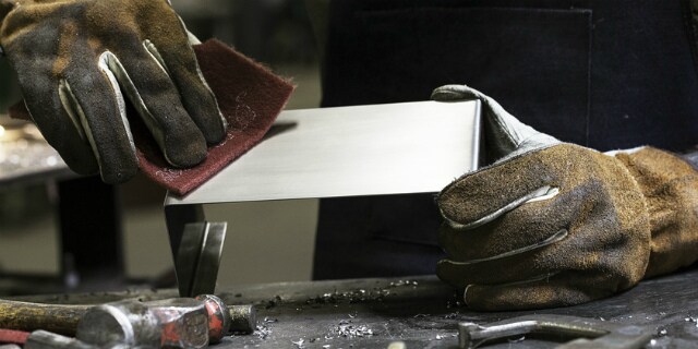 Operator using Scotch-Brite Hand Pad 7447 PRO