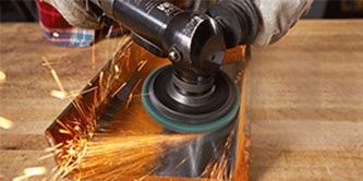 cleaning metal with 3M Scotch-Brite Clean and Strip XT Disc
