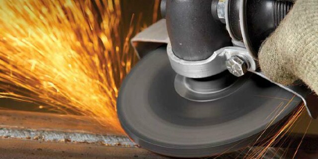 Grinding application using a 3M Silver Depressed Centre Grinding Wheel with sparks flying
