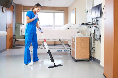nurse cleaning the floor