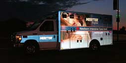 blue and white truck with advertisement
