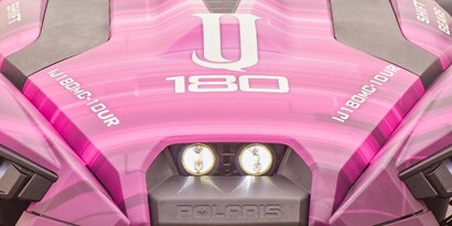 front of a pink vehicle
