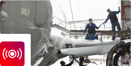 Technician repair on airplane wing
