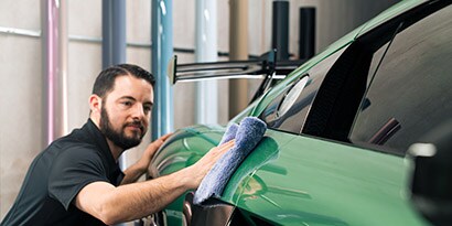 car paint protection wrap film being applied
