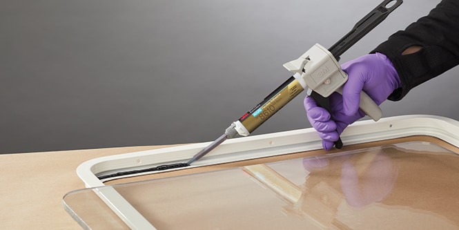 Application of 3M structural adhesives to frame and glass to seal against moisture.
