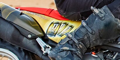 person's foot on a motorcycle
