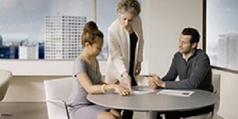 person showing something to a person
