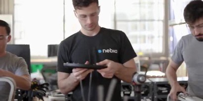 Worker applies 3M™ VHB™ Tape to a piece of trim before attachment to the main item
