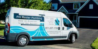 A sports car’s vehicle wrap is electric blue and reflects its surroundings.
